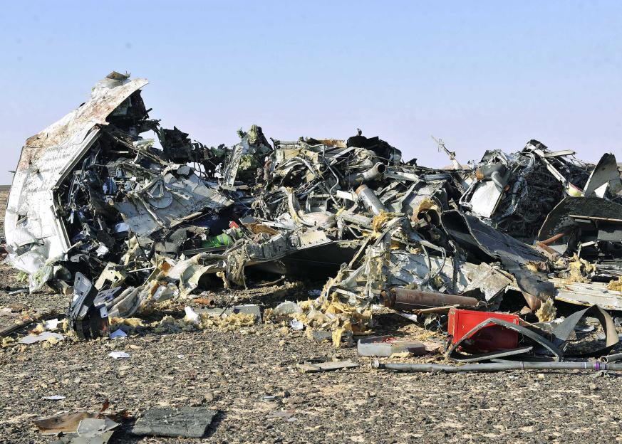 Debris from a crashed Russian jet lies scattered across the sand in Sinai, Egypt.