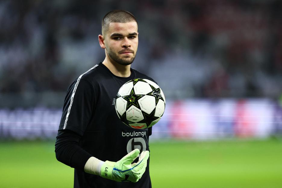 Lucas Chevalier, Lille OSC goalkeeper, holding a soccer ball.