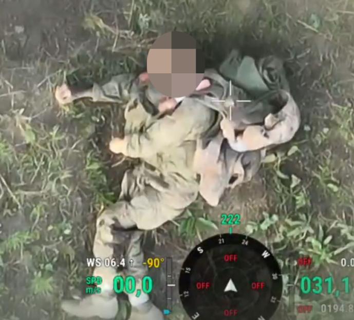 Unverified video from a drone showing an unverified fallen soldier from the 7th Rapid Response Brigade of the Air Assault Forces, with digital readouts on the screen.