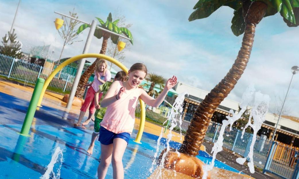 Children playing in a water park.