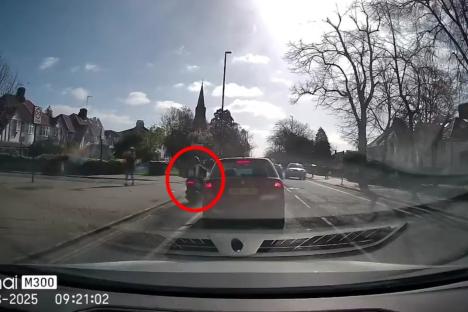 Shocking moment moped rider in cycle lane smashes into turning car… but viewers are divided over who’s to blame