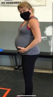 Pregnant woman wearing a face mask.