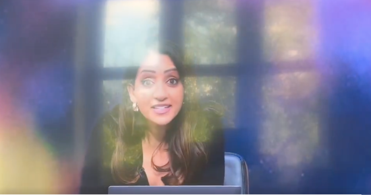 Screenshot of a woman speaking.