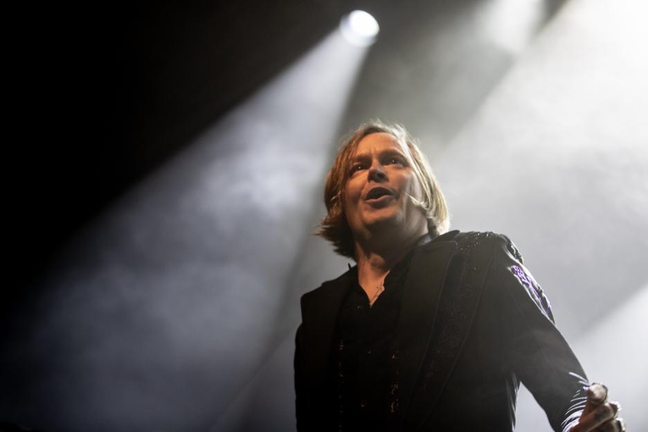 Dennis Lyxzén of Refused performing on stage.
