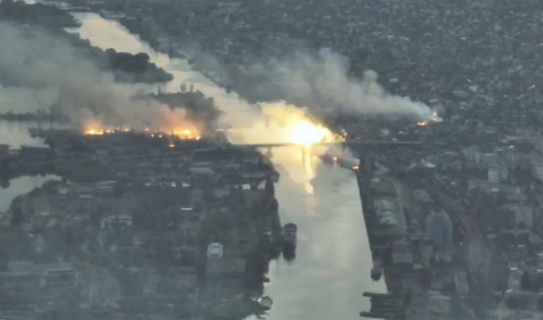 A bridge in Kherson, Ukraine, burning after being bombed.
