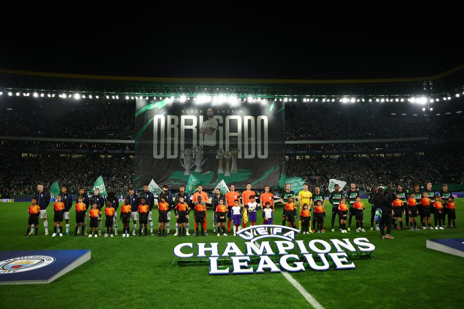Sporting CP and Manchester City players line up before a Champions League match.