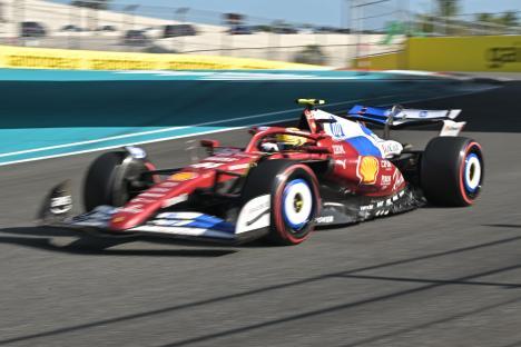 Lewis Hamilton's Formula 1 car speeding on the track.