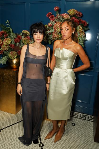 Lily Allen and Miquita Oliver at a London Fashion Week event.