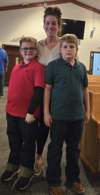 Stephanie Bell with her two sons, Lukas and Liam, after they survived a house fire.