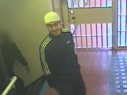 Security camera image of Hashem Abedi in an Adidas tracksuit and glasses.