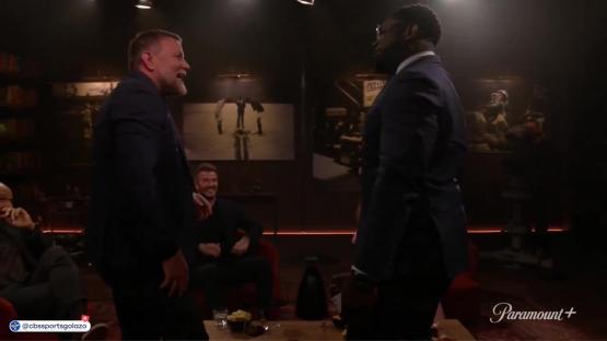 Micah Richards and David Beckham on a talk show.