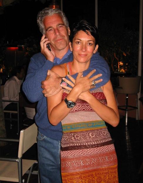 Jeffrey Epstein on the phone with Ghislaine Maxwell in his arms.