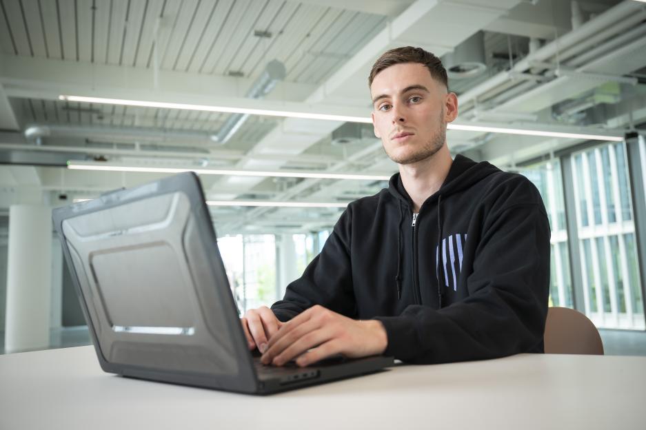 Man working on laptop.