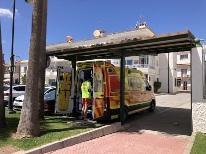 Ambulance parked in a lot.
