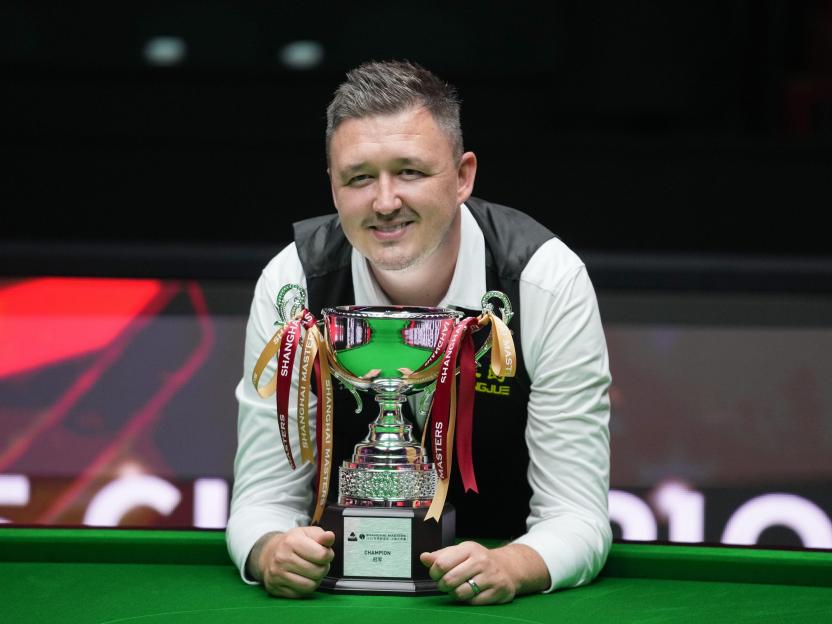 Kyren Wilson of England with the Shanghai Masters trophy.