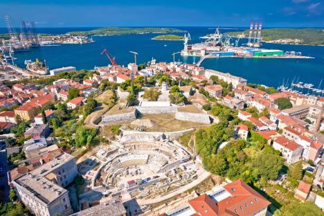 Aerial view of Pula, Istria, showing a defense fortress and the bay.