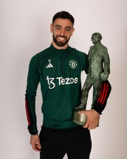 Bruno Fernandes of Manchester United holding the Sir Matt Busby Player of the Year award.