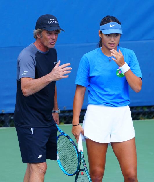 Emma Raducanu practicing tennis with her coach.