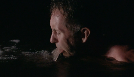 Man vomiting into water.