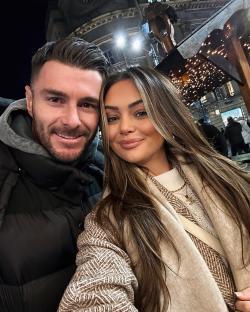 Selfie of a couple at a Christmas market.