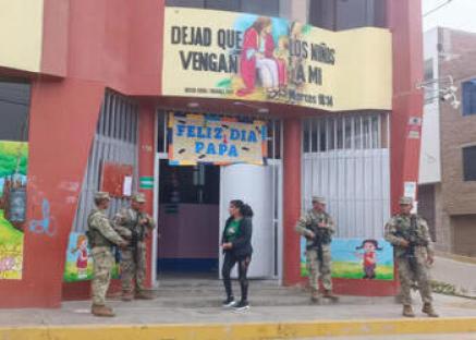 Soldiers guarding a private school.