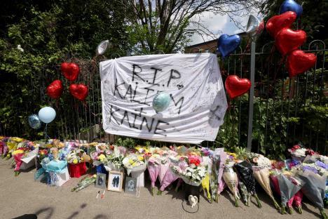 Floral tributes and messages for Kai and Kane.