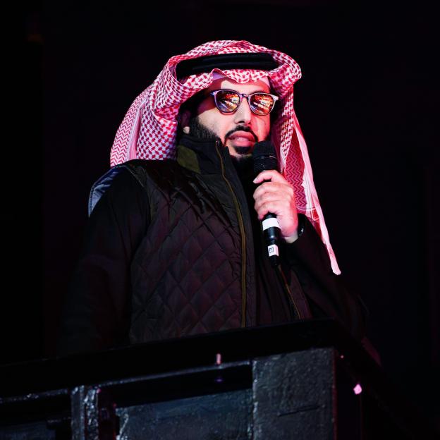 Turki Al-Sheikh, Chairman of General Entertainment Authority of Saudi Arabia, speaking into a microphone.