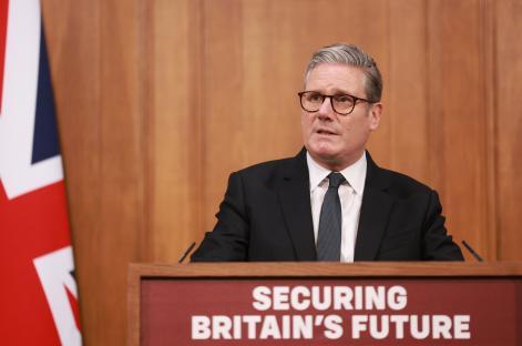 Keir Starmer giving a press conference on immigration.