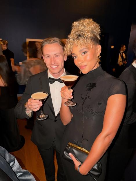 Lionesses captain Leah Williamson and Miss USA, Elle Smith, holding espresso martinis.