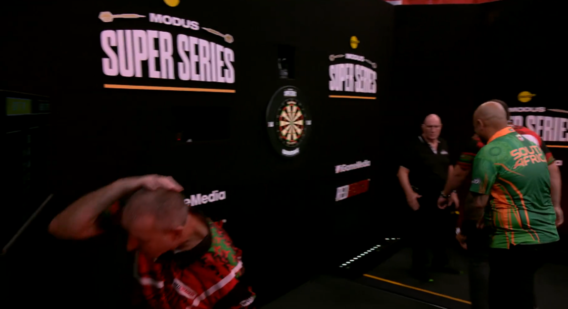 Darts player at Modus Super Series event.