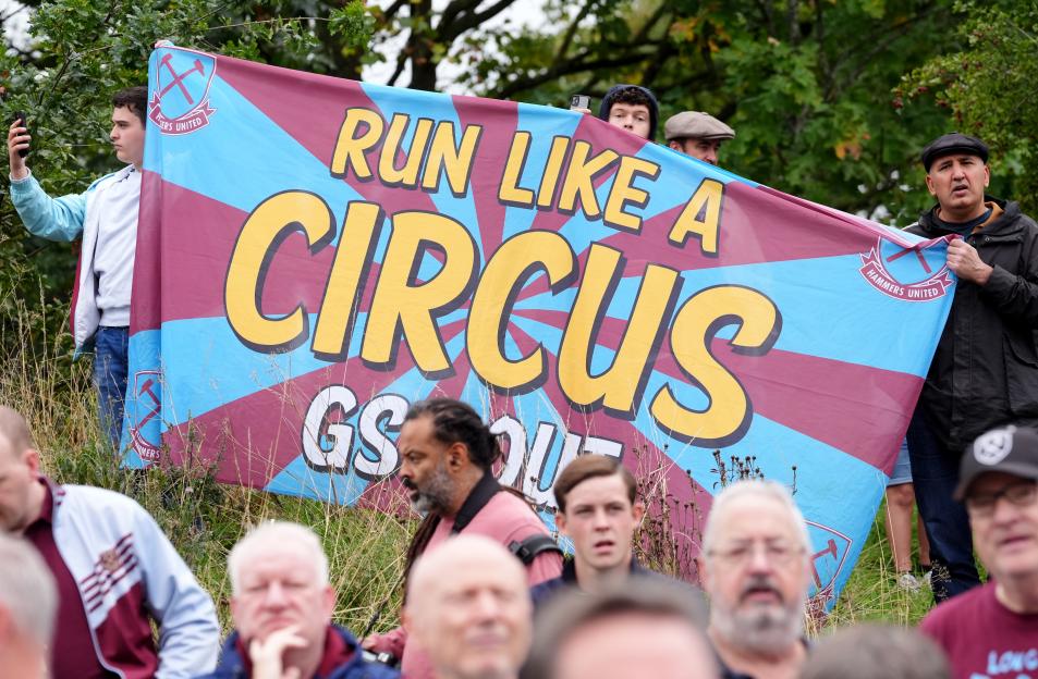 West Ham United fans protest with a banner that reads "Run Like a Circus GS Out".