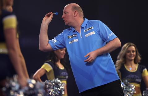 Vincent van der Voort throwing a dart at the PDC World Darts Championship.