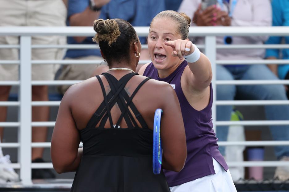 Jelena Ostapenko of Latvia arguing with Taylor Townsend of the United States during a tennis match.