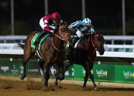 Two horses racing neck and neck in the Saudi Cup.