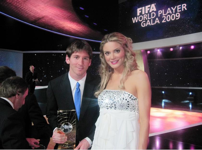 Photo of Lionel Messi holding an award with a woman at the FIFA World Player Gala 2009.