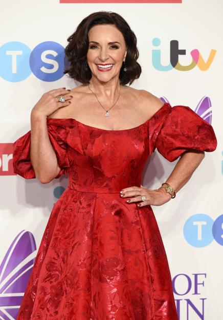 Shirley Ballas at the Pride of Britain Awards in a red floral dress.