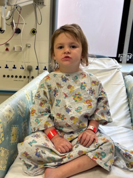 Teraysa, aged three, in a hospital gown.