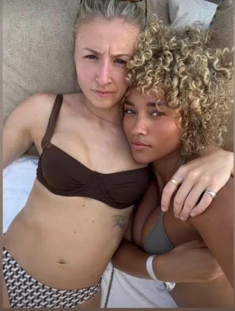 Leah Williamson and model Elle Smith embracing.