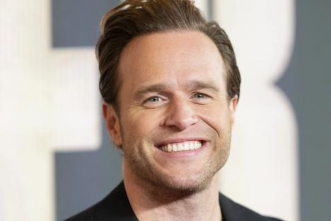 Olly Murs reveals he and wife Amelia are expecting their second child as he shares sweet family clip