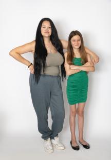A mother and daughter posing together.