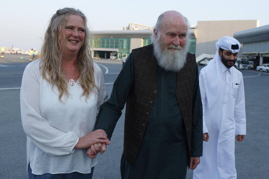 Sarah Entwistle holding her father Peter Reynolds's hand after their release in Afghanistan.