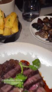 Steak dinner with potatoes and mushrooms.