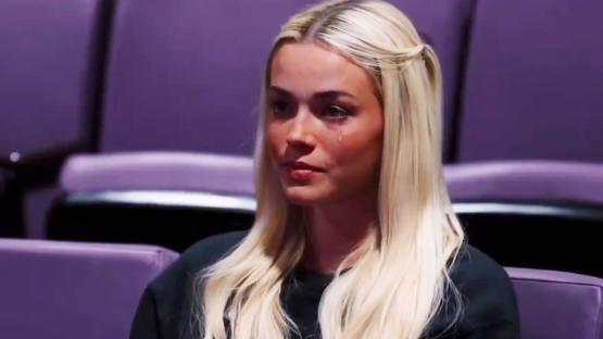 Woman crying in a theater.