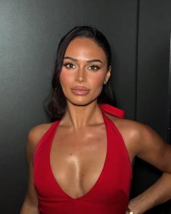 Olivia Hawkins in a red halter top.