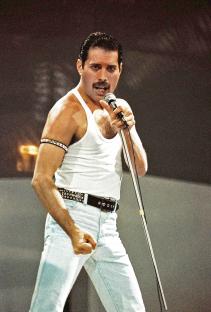 Freddie Mercury of Queen performing on stage.