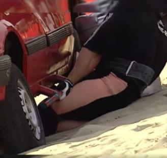 Strongman injured while pulling a car.