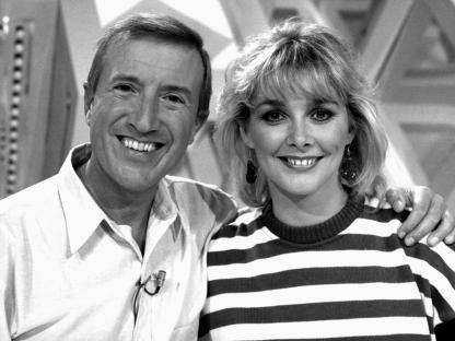 Black and white photo of Roy Castle and Cheryl Baker.