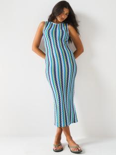 Woman in a blue and yellow striped crochet midi dress.