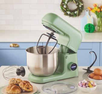 Sage green stand mixer with attachments and Easter treats.