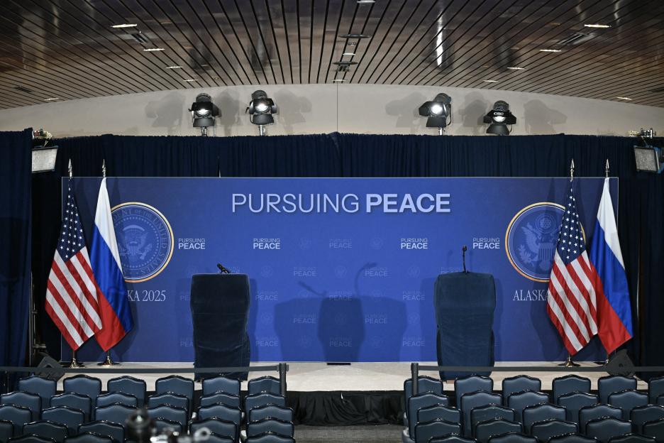 Empty podium with US and Russian flags for a summit on peace.